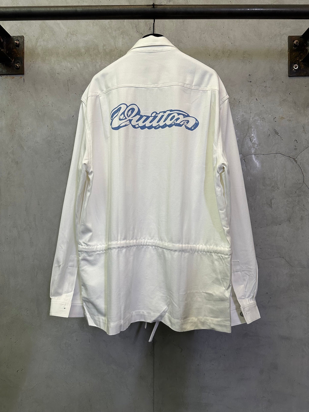 White long-sleeve jacket with back logo and drawstring hem