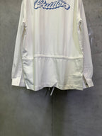White long-sleeve jacket with blue back logo and gathered hem