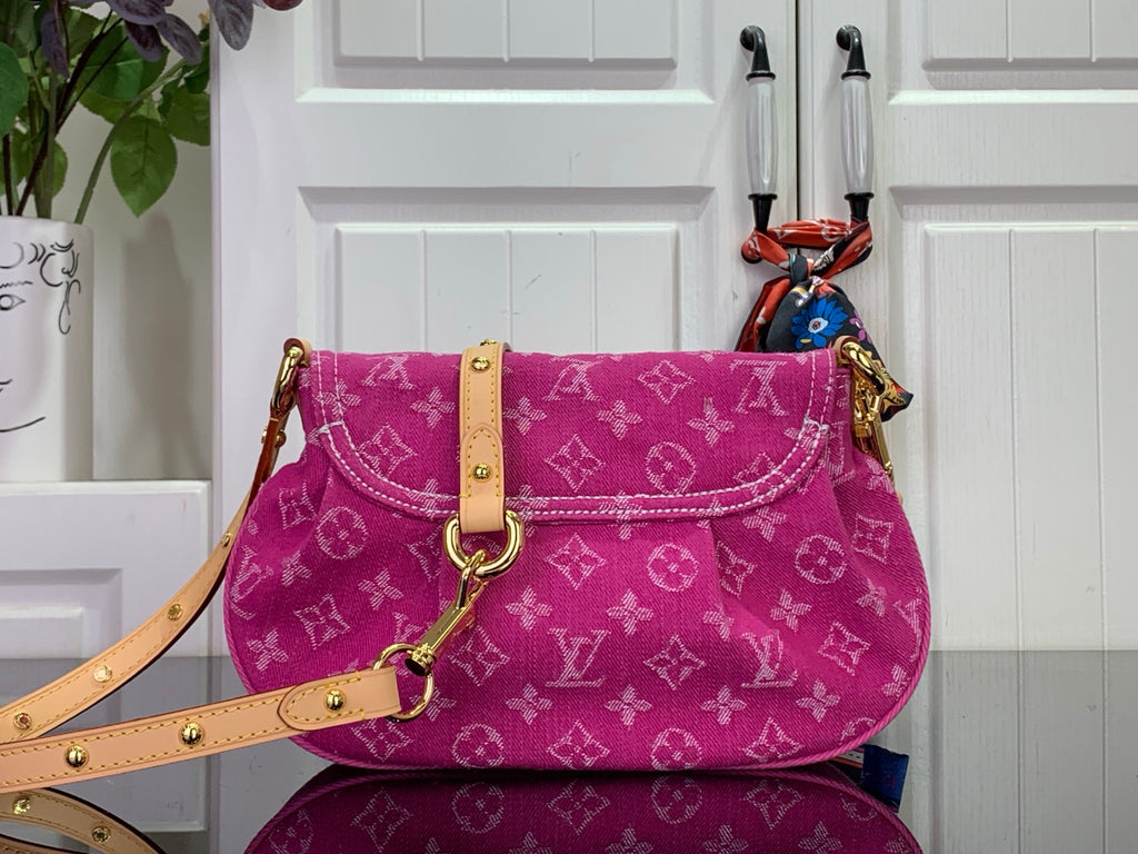 Louis Vuitton monogram handbag in magenta with shoulder strap and front flap