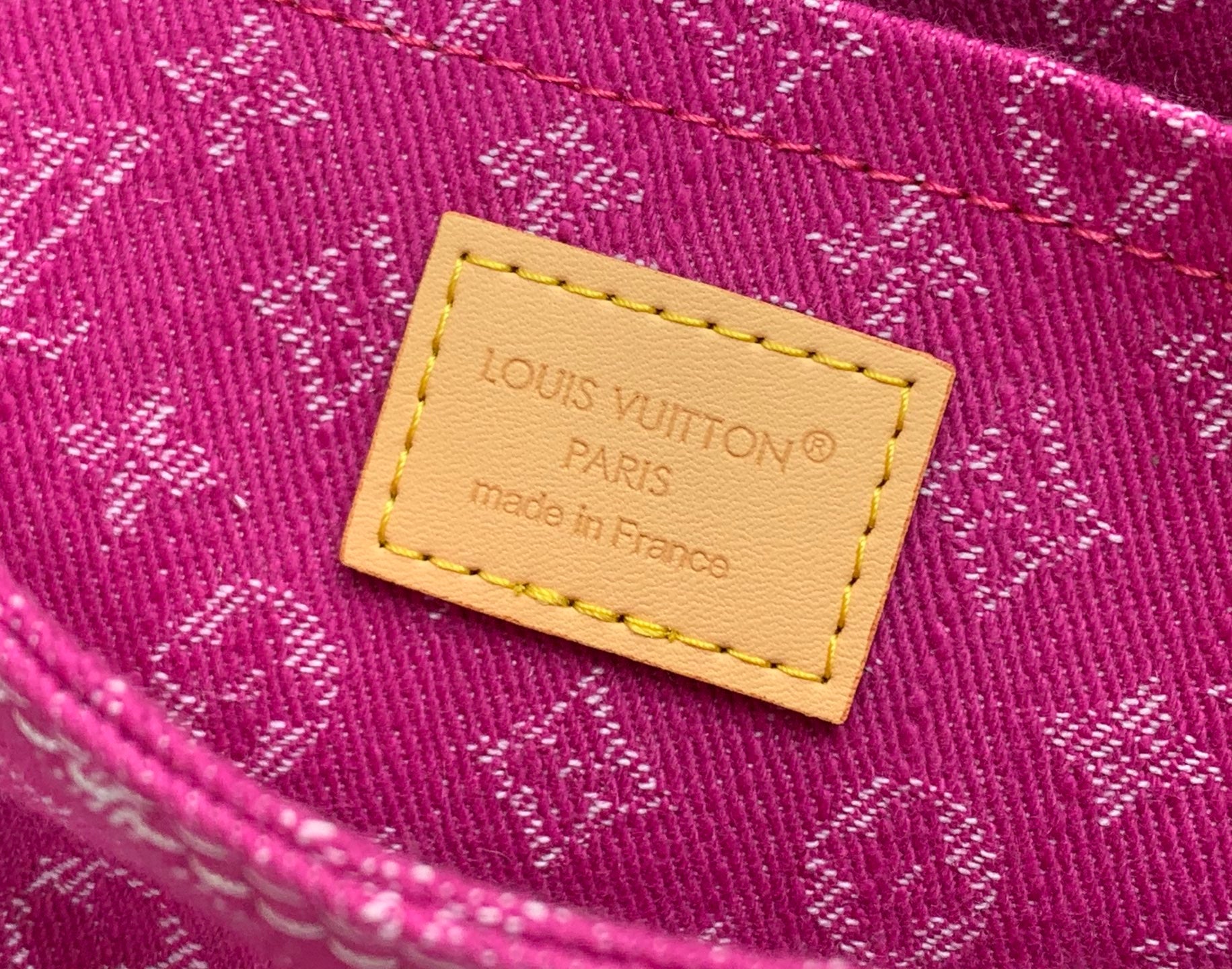 Louis Vuitton monogram handbag fabric label patch with “Louis Vuitton Paris” text