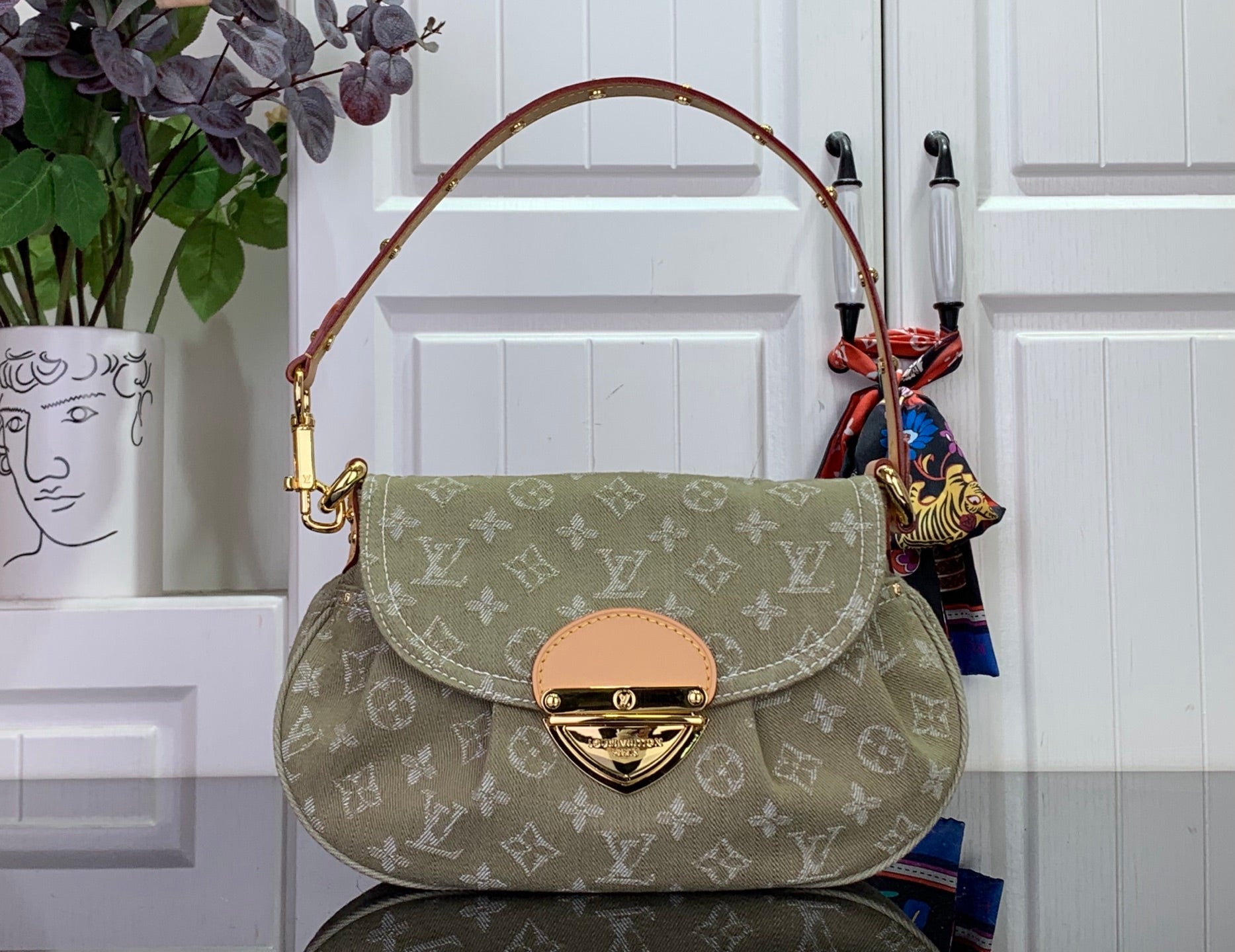 Louis Vuitton monogram handbag with flap, tan trim and gold-tone hardware