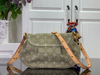 Monogram handbag with flap, tan shoulder strap and gold hardware