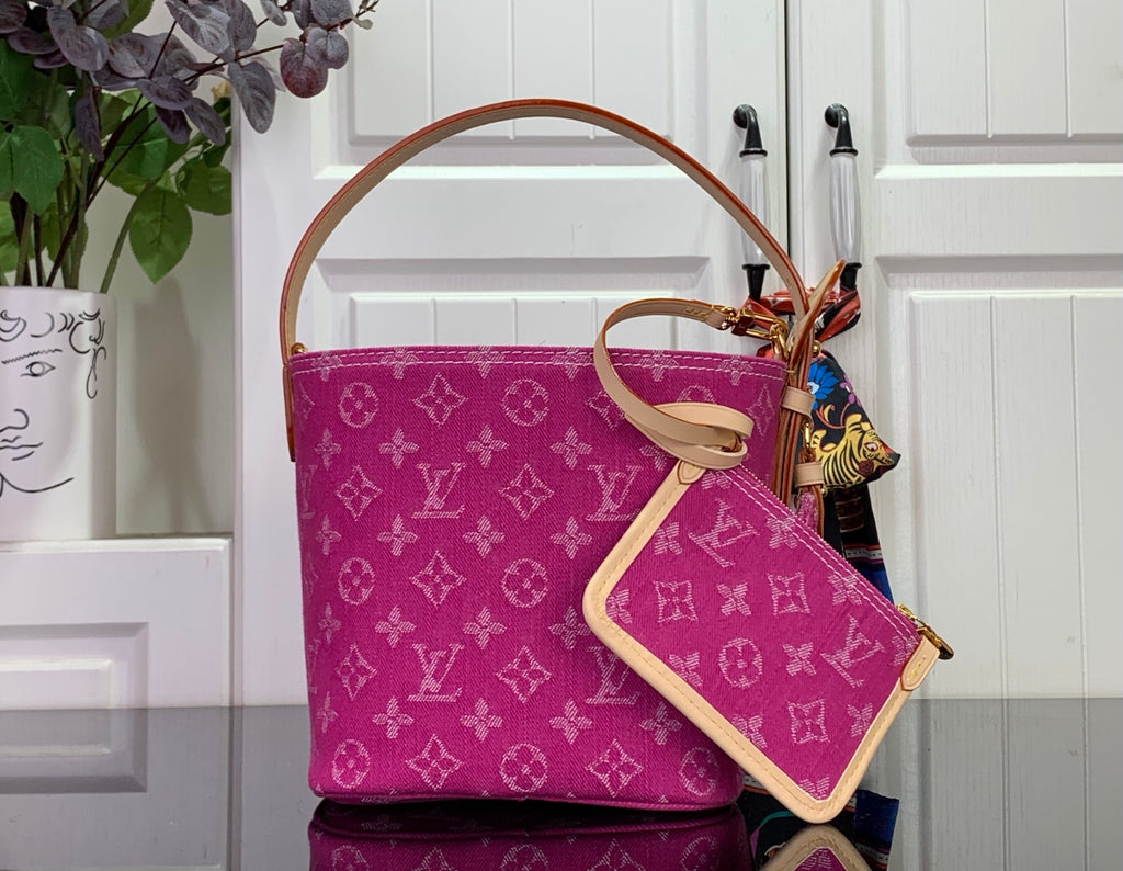 Magenta monogram tote with tan adjustable shoulder strap and side pocket