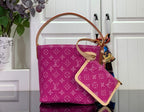 Magenta monogram tote with tan adjustable shoulder strap and side pocket