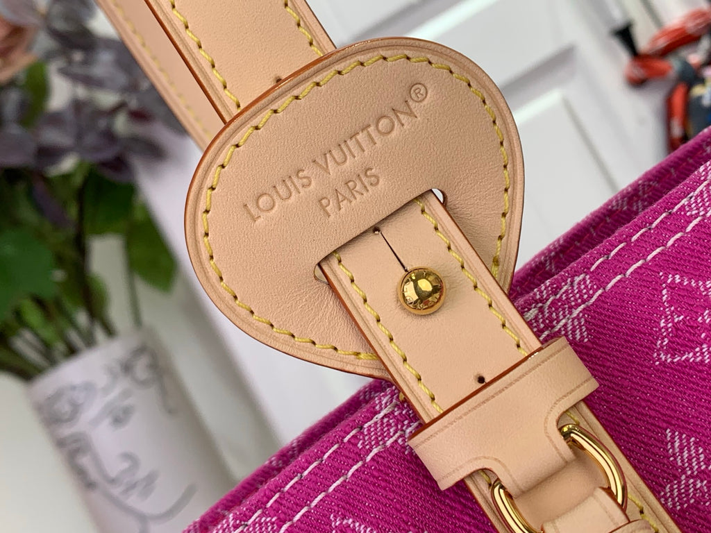 Mini bag label patch on magenta monogram, tan leather trim and snap hardware