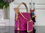 Magenta monogram tote with tan leather strap and matching front zip pocket