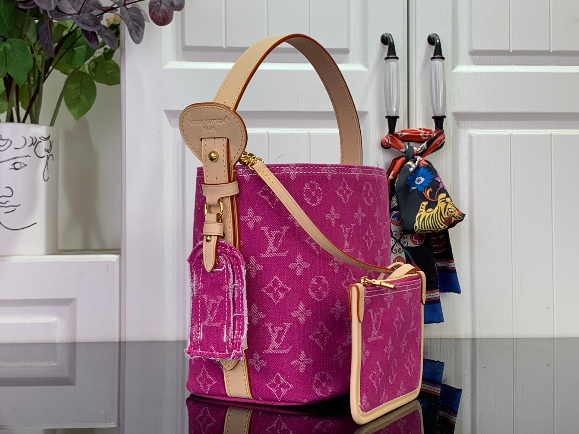 Magenta monogram tote with tan leather strap and matching front zip pocket