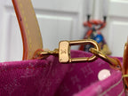 Magenta monogram tote with gold-tone D-ring clasp and tan shoulder strap