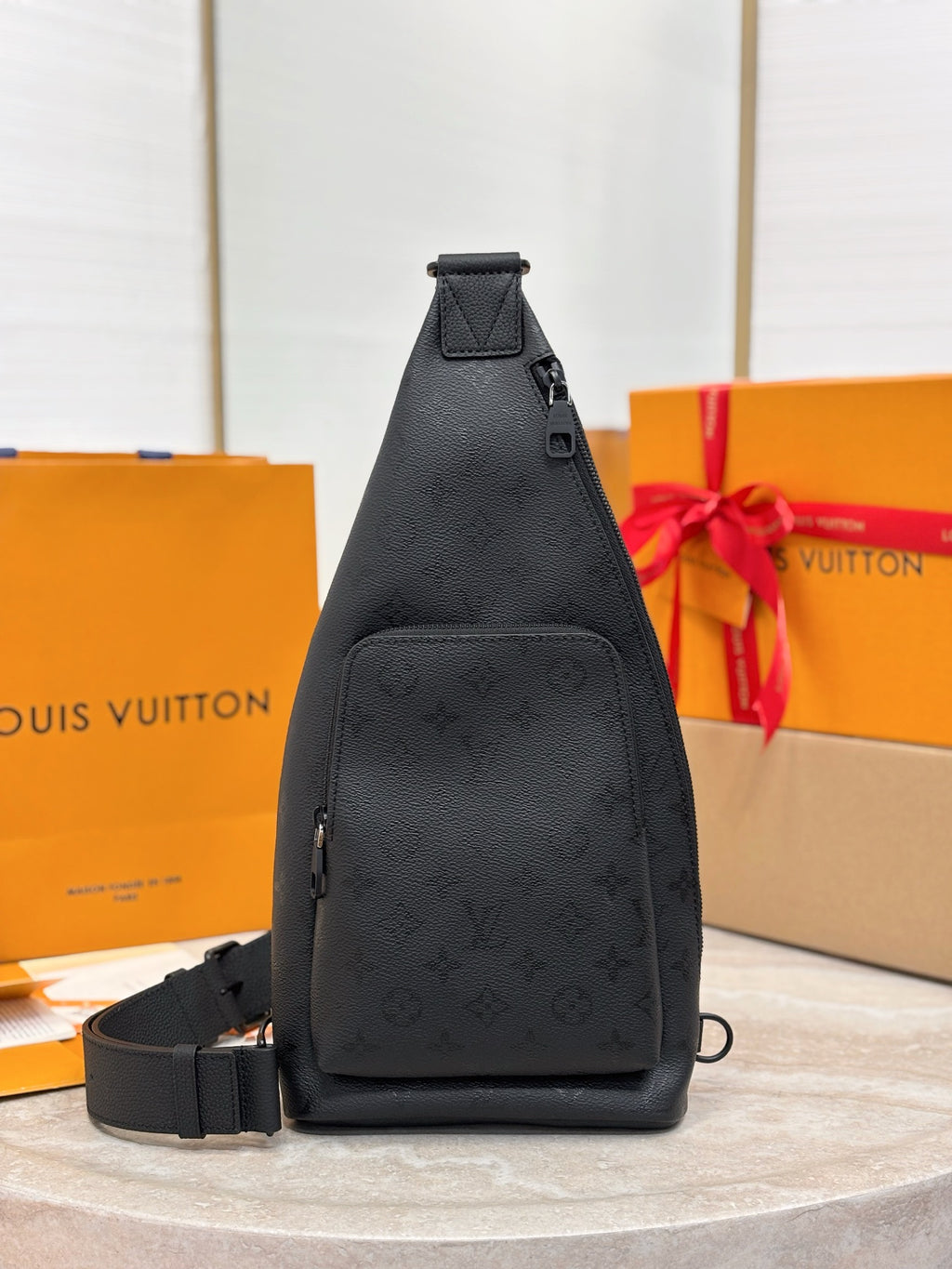 Louis Vuitton black monogram sling bag with top handle and adjustable strap