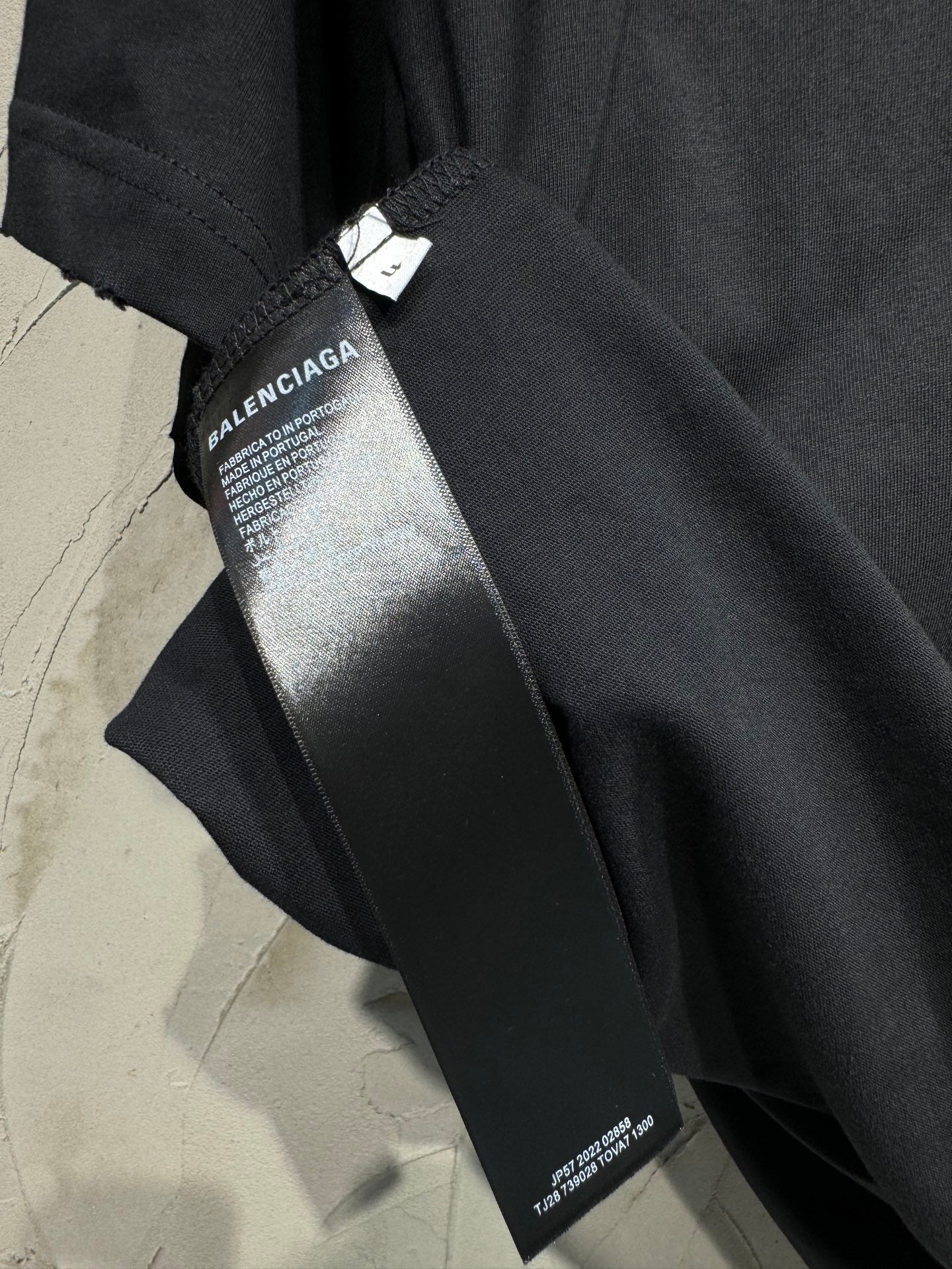 Black Balenciaga shorts with logo tag and printed side label