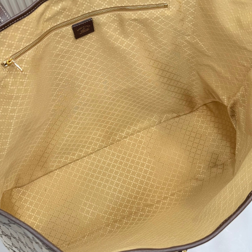 Gucci tote bag interior lining with zip pocket and stitched seams, tan fabric