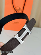 Dark brown leather belt close-up with H buckle and textured strap