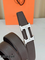Dark brown leather belt with embossed texture and H buckle, side view