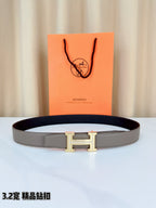 Hermes leather belt with light gray strap and gold-tone H buckle closure
