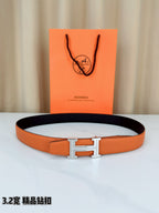 Hermes H-buckle belt, orange leather with silver buckle and black underside