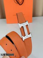 Hermes H-buckle belt, orange textured leather with silver buckle and hole detail