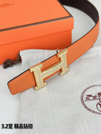 Hermes H-buckle belt, orange pebbled leather with silver H buckle detail