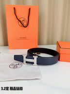 Blue leather Hermes belt with silver H buckle, on dust bag