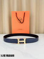 Hermes belt in dark blue leather with silver H buckle, laid flat