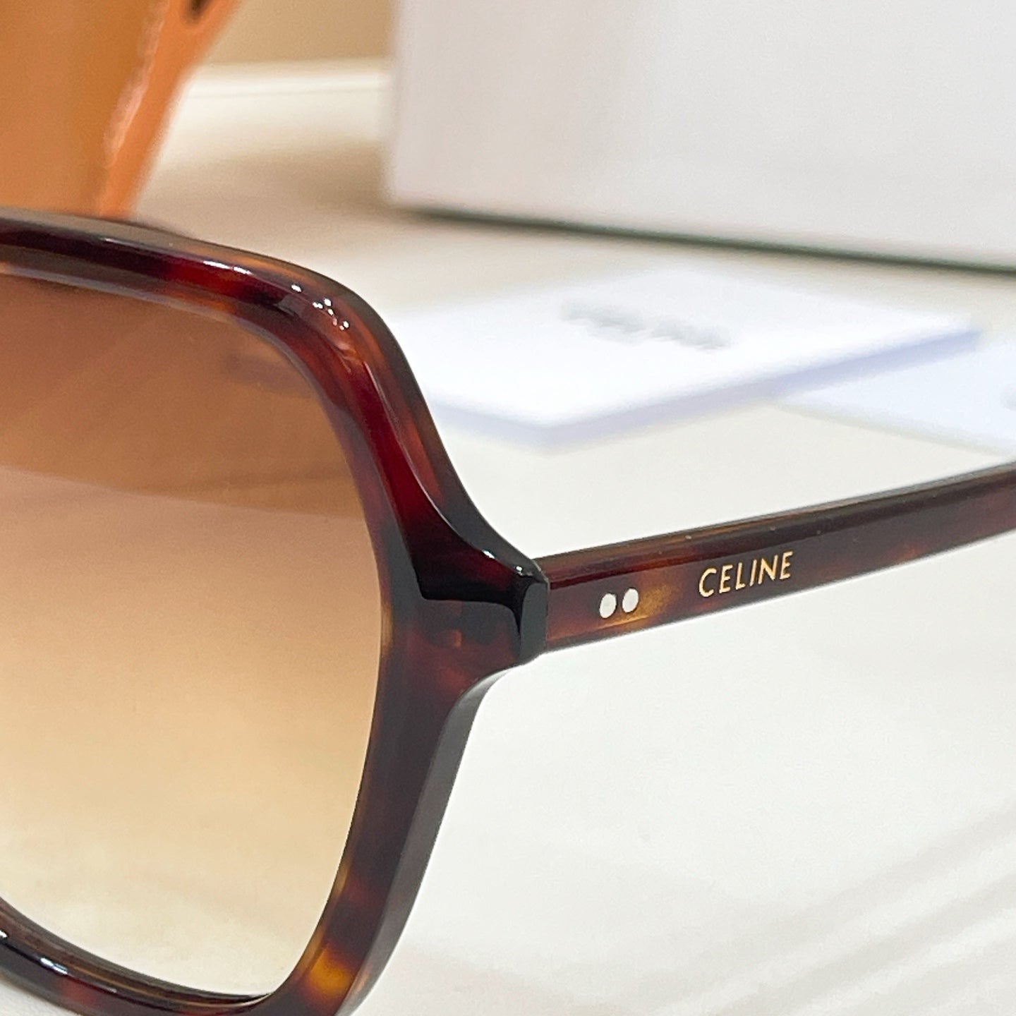 Celine acetate eyeglasses temple with logo plate and tortoiseshell frame
