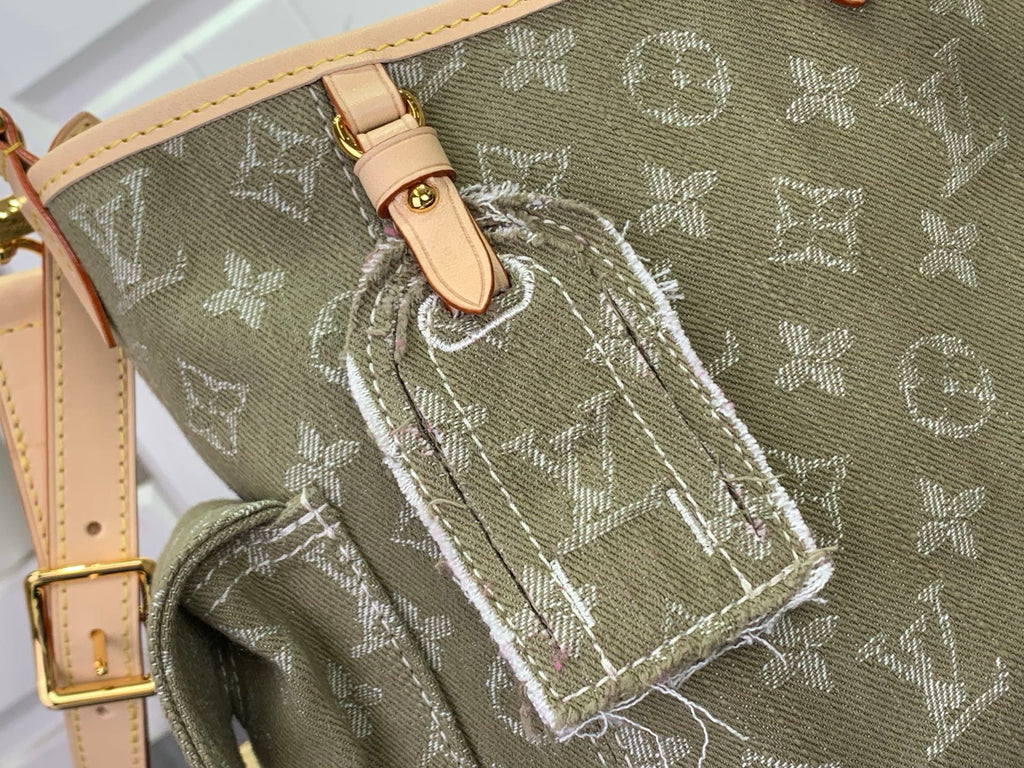Olive monogram bag close-up with stitched leather strap and woven edging