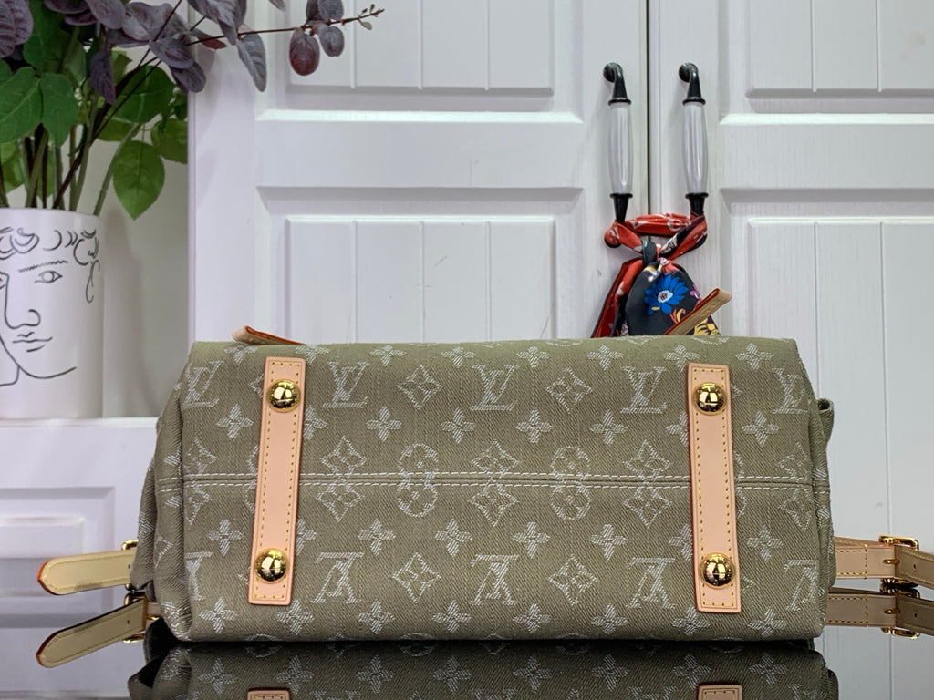 Olive monogram hobo bag with two front flap pockets and tan leather straps