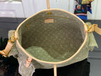 Olive monogram hobo bag interior view with tan leather trim