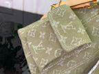 Olive monogram bag corner with stitched edge and layered tan strap