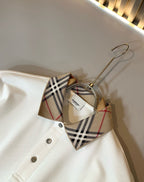 Off-white Burberry polo shirt collar with check trim and button placket