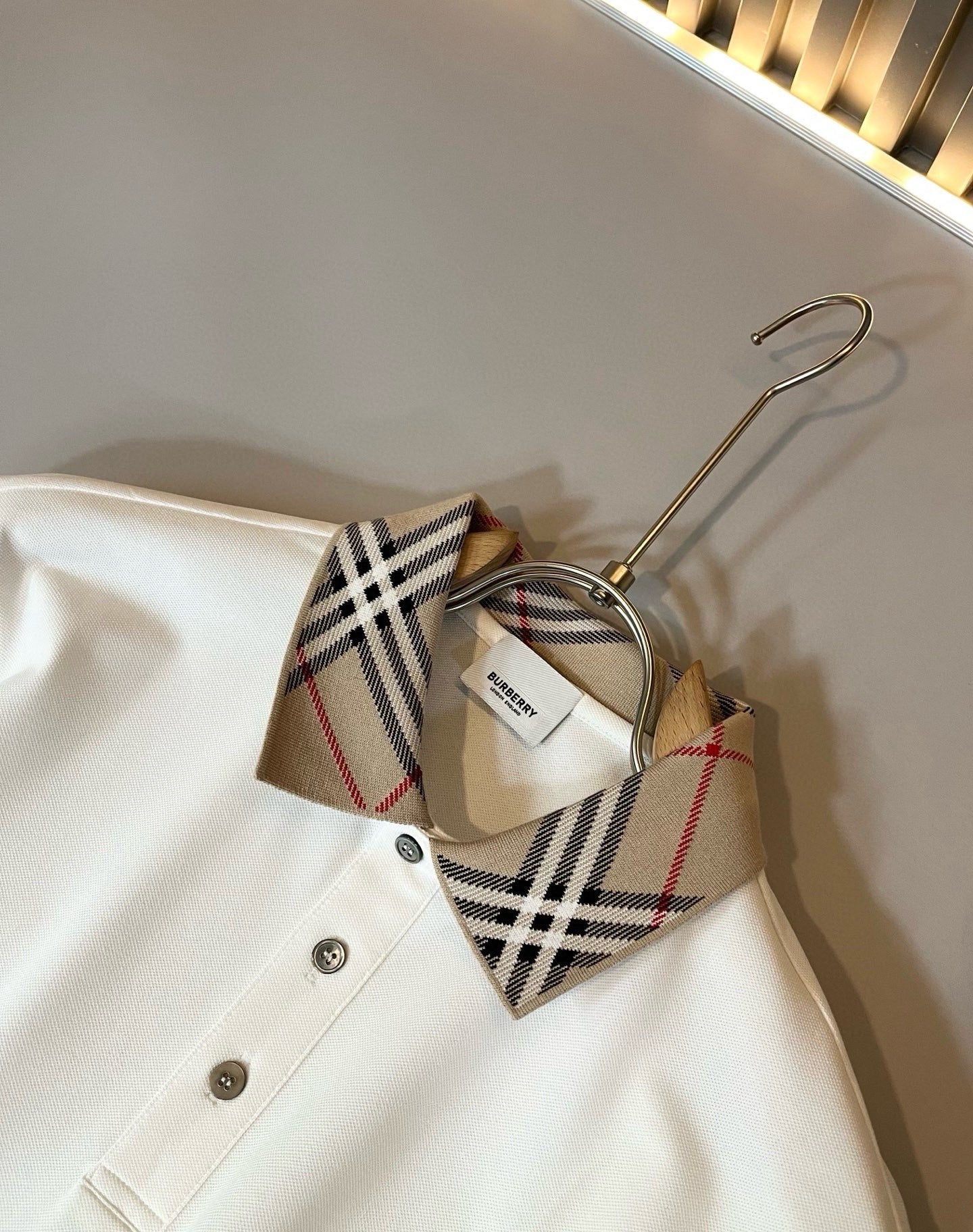 Off-white Burberry polo shirt collar with check trim and button placket