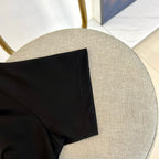 Black polo shirt side hem and inner seam detail