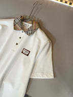 Burberry white short-sleeve polo shirt with check collar and logo patch