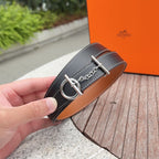 Hermes belt end with dark navy strap, silver buckle ring and chain
