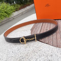 Hermes belt in dark navy leather with gold-tone buckle and chain detail