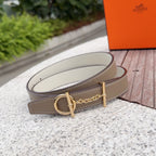 Hermes belt with taupe leather strap, gold buckle, and stitched edge