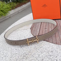Taupe leather belt with gold-tone buckle, punched holes