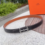 Hermes belt, dark leather with tan edge and silver buckle hardware.