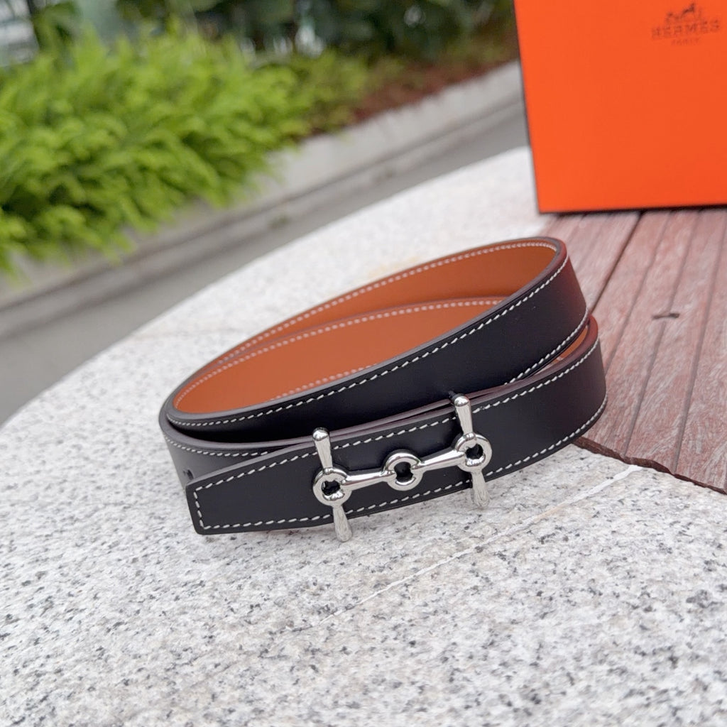 Hermes belt, dark leather with tan lining and silver buckle, double-stitch trim.
