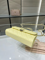 Quilted Chanel shoulder bag with long gold chain strap, light yellow leather, flap top