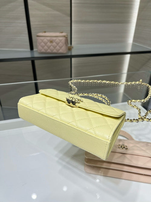 Quilted Chanel shoulder bag with long gold chain strap, light yellow leather, flap top