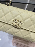 Quilted Chanel flap bag with CC-style turn-lock, light yellow textured leather