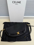 Black Celine flap shoulder bag with gold logo clasp and black crossbody strap