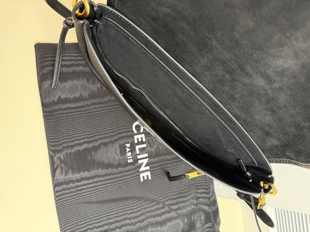 Dark bag side pocket with Celine Paris logo and adjustable crossbody strap