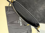Dark bag side pocket with Celine Paris logo and adjustable crossbody strap