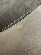 Celine Paris stamped on beige leather trim along bag seam