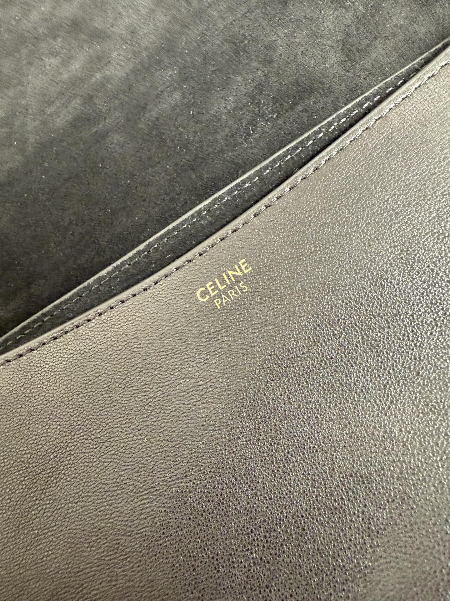 Celine Paris stamped on beige leather trim along bag seam