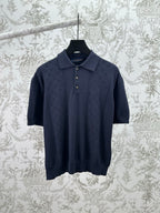 Navy knit polo shirt with button placket and short sleeves