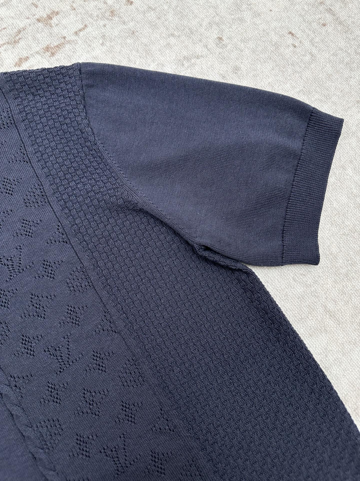 Navy knit polo sleeve with textured fabric and ribbed cuff