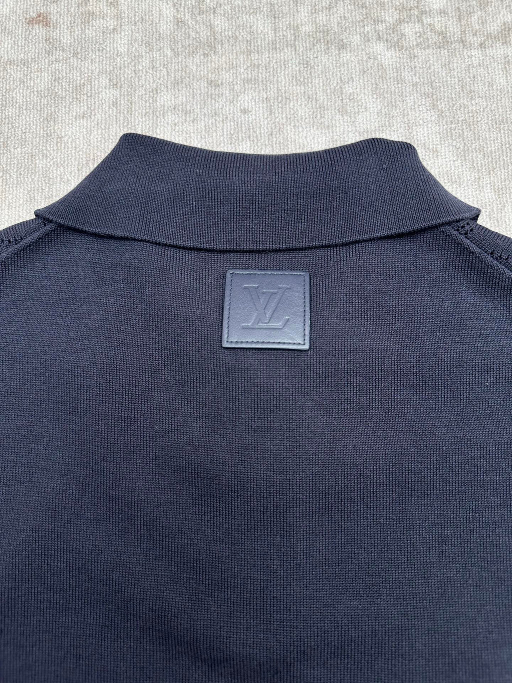 Navy polo shirt back with Louis Vuitton engraved plate at the neck