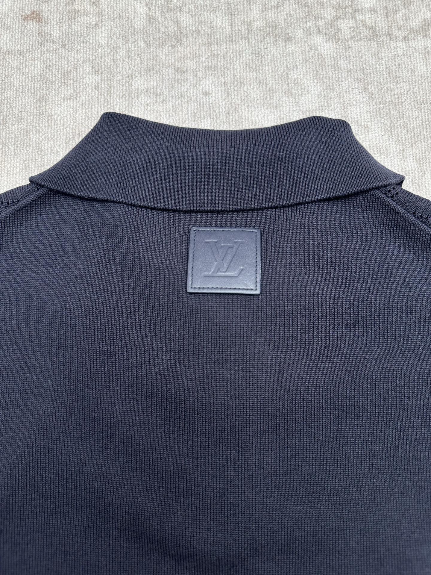 Navy polo shirt back with Louis Vuitton engraved plate at the neck